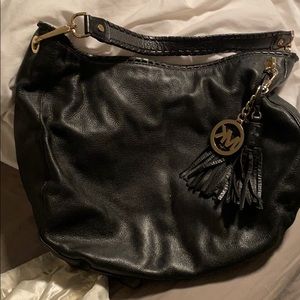 Blacked pebbled leather Michael kors hobo purse.